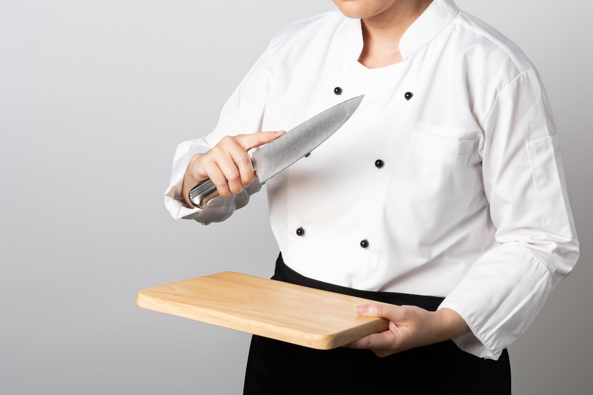 Chef instructor demonstrating knife skills